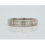An 18ct white gold and diamond half eternity ring