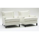 A pair of square back easy armchairs