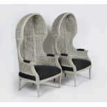 A pair of grey-painted double-caned porters’ chairs