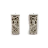 A pair of reconstituted marble wall brackets