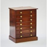 A mahogany Wellington style collector’s chest