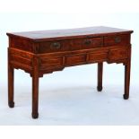 A Chinese hardwood three drawer serving table