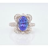 An 18ct white gold, tanzanite and diamond set dress ring