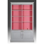 A grey-painted open bookcase cabinet