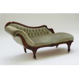 A Victorian mahogany chaise lounge