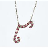 A ruby and diamond pendant necklace