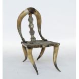 A horn and horn veneered occasional chair