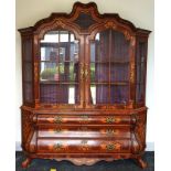 A Dutch style floral marquetry inlaid bonnet topped display cabinet chest