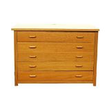 A modern oak five drawer plan desk