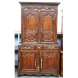 A French carved oak and chestnut double height buffet