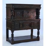 A carved oak court cupboard