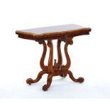 A Victorian figured walnut card table of serpentine outline