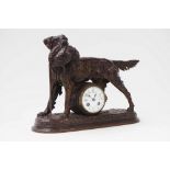 A patinated spelter mantel clock