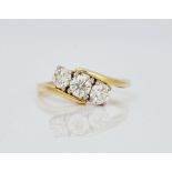 An 18ct gold and diamond set three stone ring