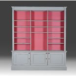 A grey-painted open bookcase cabinet