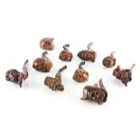 TEN CARVED WOOD FIGURAL PIPES (10)