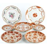 Six pieces of Chinese iron-red and gilt porcelains and a famille-rose export plate