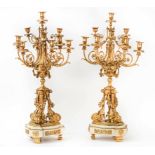 A pair of French gilt-metal and white marble ten-light candelabra