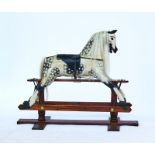 A painted wooden rocking horse