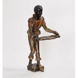 A polychrome painted figure of a blackamoor