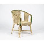 A cream and green-painted caned armchair (2)