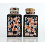 A pair of Japanese Imari canisters and two covers