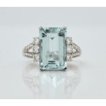 An 18ct white gold, aquamarine and diamond set ring