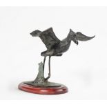 A patinated bronze model of a stork