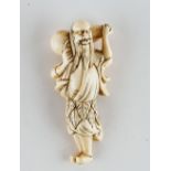 A Japanese ivory netsuke of a sennin