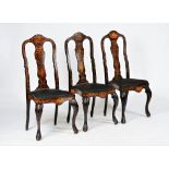 A set of three Dutch mahogany and marquetry inlaid side chairs