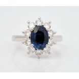 A platinum, sapphire and diamond cluster ring