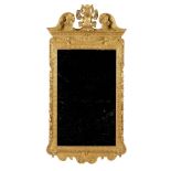 A George II style giltwood mirror with cartouche crest