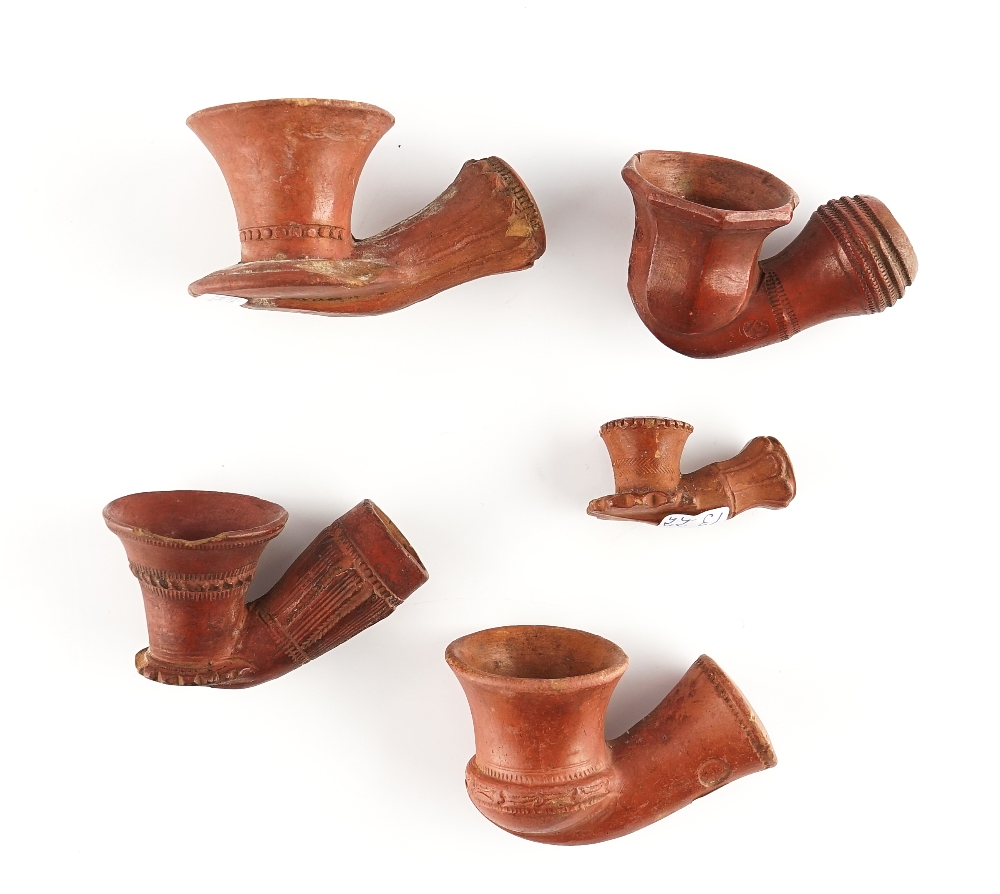 FIVE MIDDLE EASTERN CLAY PIPE HEADS (4)