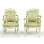 A set of four cream painted Louis XV style open armchairs