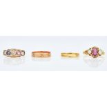 An opal and garnet set three stone ring and three other rings (4)