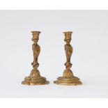 A pair of French gilt-bronze candlesticks