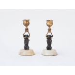 A pair of gilt-metal and white marble candlesticks