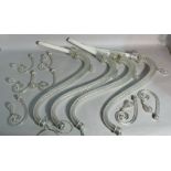 A large group of Venetian glass chandelier arms of varying sizes.