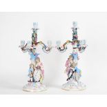 A pair of German porcelain four-light candelabra