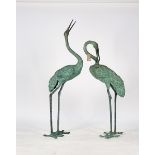 A PAIR OF BRONZE STORKS