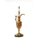 A GILT-METAL 'CELLINI STYLE' EWER MOUNTED AS A TABLE LAMP