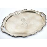 A silver shaped oval twin handled tray