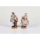 A pair of Meissen figures of gardeners