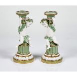 A pair of Minton white and celadon glazed porcelain candlesticks