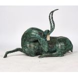 A BRONZE MODEL OF RECUMBENT ANTELOPE