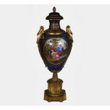 A tall Sevres-style ormolu mounted earthenware two-handled vase and cover