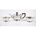 A silver three-piece tea set