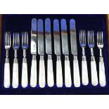 A set of six pairs of silver dessert or fruit knives and forks