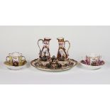 A Dresden cruet set and two German cups and saucers