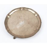 A George III silver shaped circular waiter